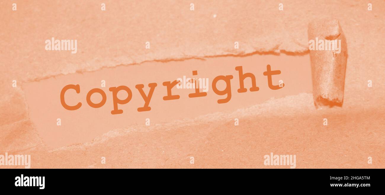Carta strappata di uner di parola del copyright. Marcatura legale del marchio, concetto aziendale. Foto Stock
