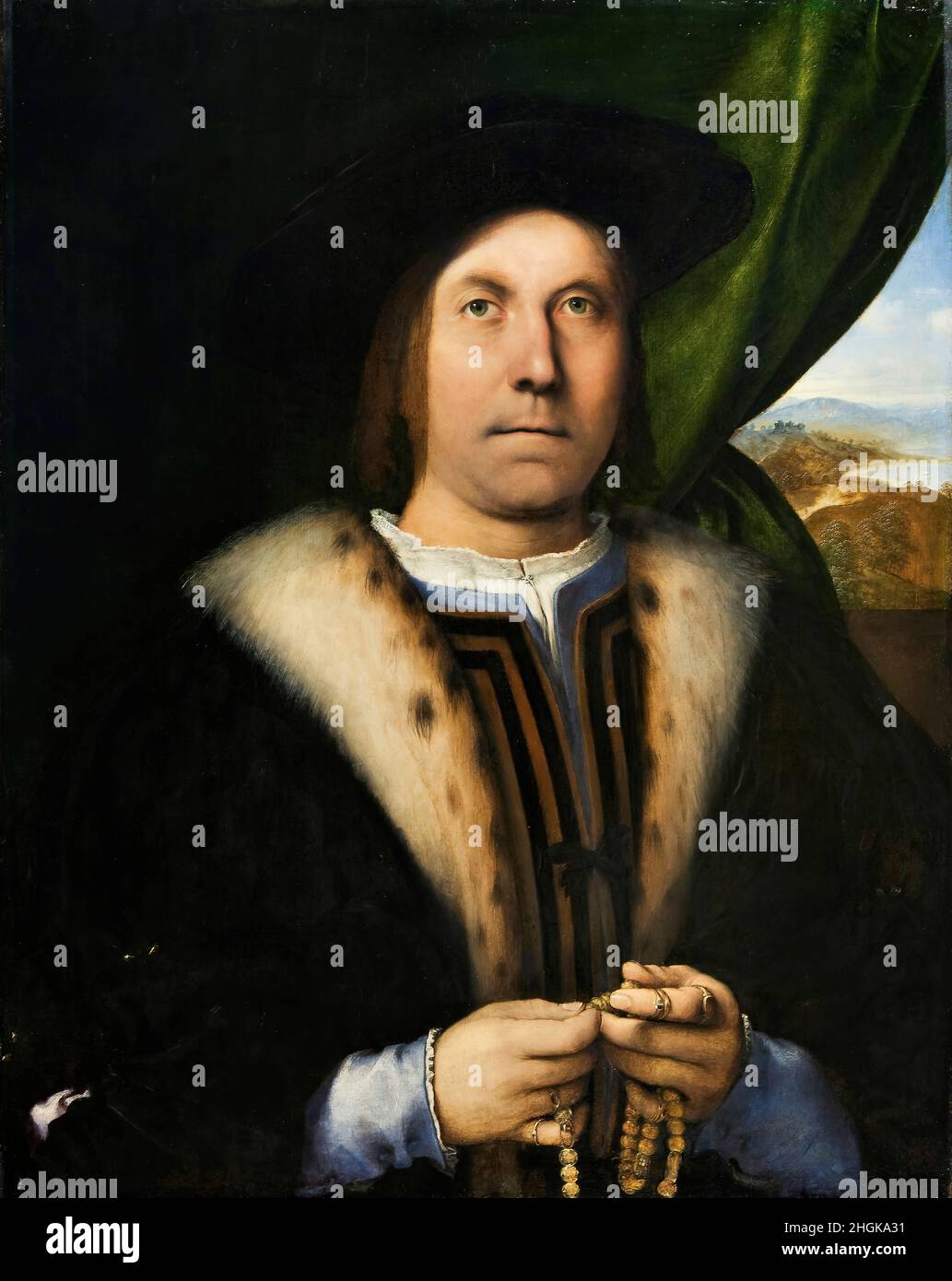 Ritratto di un uomo con un Rosario - 1520c. - olio su legno 78,5 x 62 cm - Lotto Lorenzo Foto Stock