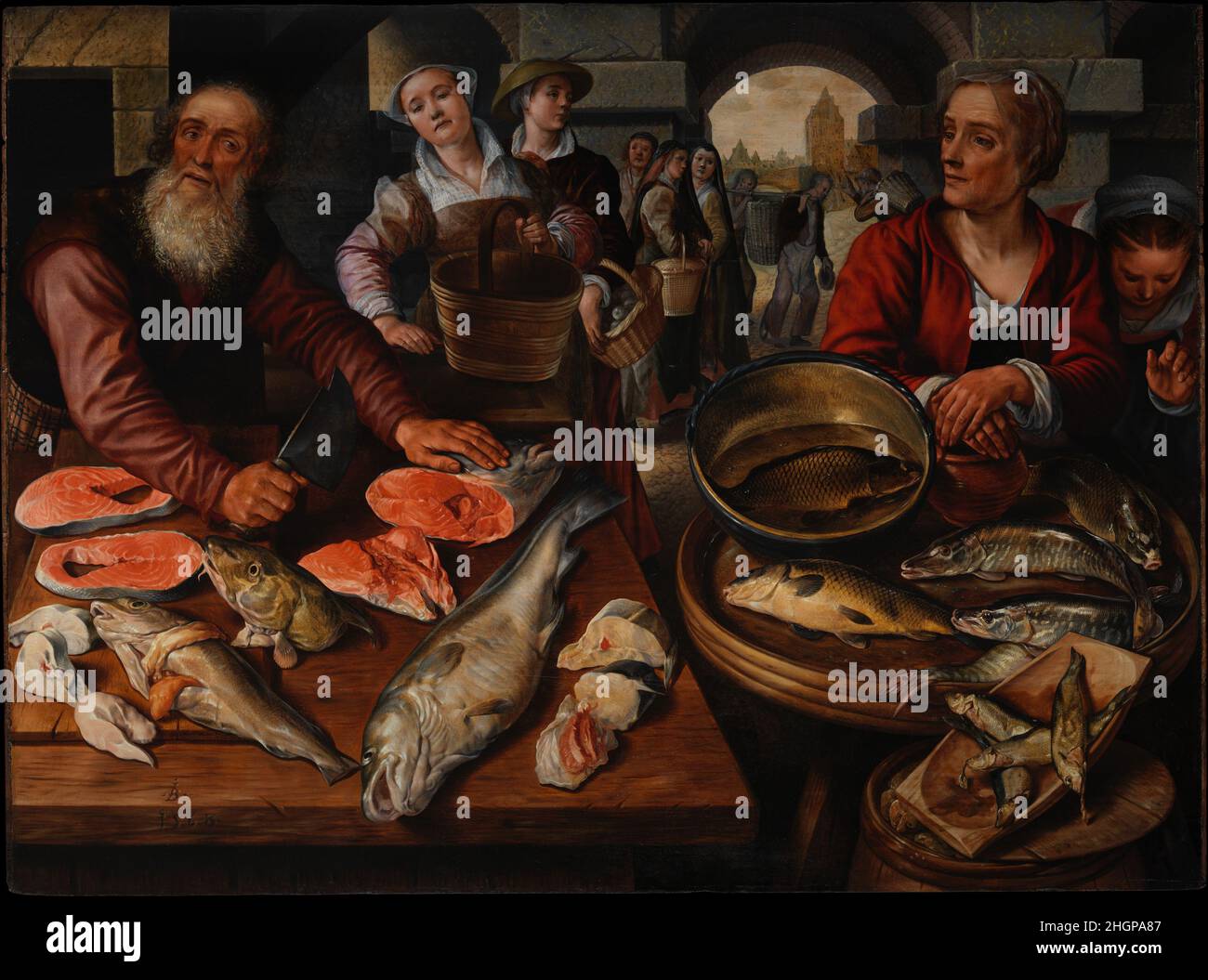 Mercato del pesce 1568 Joachim Beuckelaer Netherlandish firmato e datato 1568, questa vista magistralmente composta di un mercato del pesce quotidiano rappresenta il nuovo genere della pittura di natura morta, iniziata da Joachim Beuckelaer e dal suo insegnante, Pieter Aertsen, che visse e lavorò ad Anversa. Fu dipinto durante i tempi tumultuosi dell'iconoclasmo (1566), che sconvolse il mercato dell'arte e motivò un cambiamento da temi puramente religiosi a temi più secolari. Qui la fiorente industria del pesce viene celebrata attraverso l'esposizione della grande abbondanza dal mare. Tali immagini inoltre hanno abbracciato sempre più una moralizzazione Foto Stock