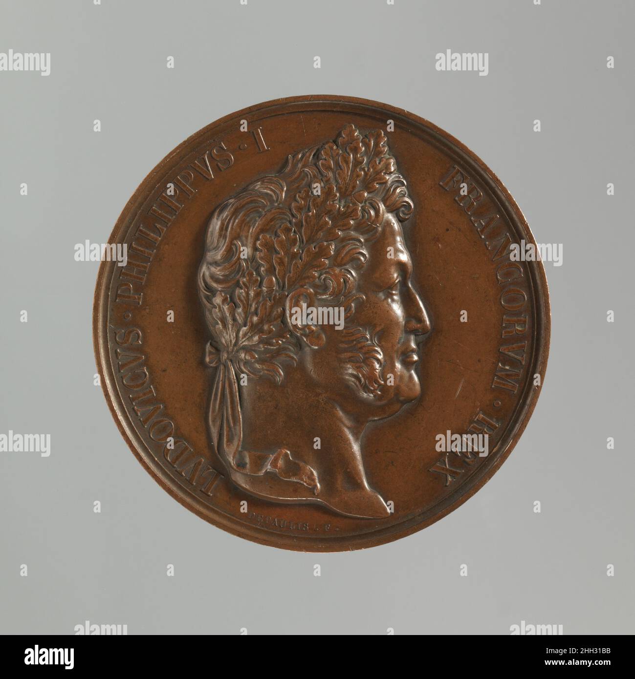 Concordiae 1830 Alexis Joseph Depaulis questa medaglia fu senza dubbio commissionata dallo stesso Louise Philippe per celebrare la Restaurazione della Monarchia dopo la Rivoluzione Francese del 1830. Il titolo espresso sulla medaglia, “Re dei francesi”, piuttosto che Re di Francia, significa la sua elezione da parte dei suoi sudditi in conformità con le nuove leggi costituzionali. Come con Napoleone nei primi anni del diciannovesimo secolo, Louis Philippe fu abile a usare l'arte della medaglia per promuovere la propaganda Royalista durante la sua monarchia di luglio. Più di ventotto effigi di lui sono noti per esistere, undersco Foto Stock