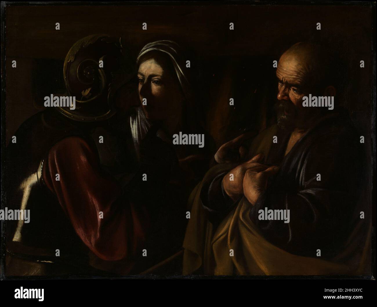 Il Denial of San Pietro 1610 Caravaggio (Michelangelo Merisi) le opere tardive del Caravaggio italiano dipendono per il loro drammatico effetto su aree luminose che si ergono in contrasto con uno sfondo scuro. Il quadro, una meraviglia della concisione narrativa, è stato dipinto negli ultimi mesi della tempra vita di Caravaggio e segna una tappa estrema nel suo stile rivoluzionario. In piedi davanti ad un camino, Pietro è accusato di essere un seguace di Gesù. Il dito puntato del soldato e le due dita della donna alludono alle tre accuse e alle tre negazioni di Pietro. Nel 1613 il dipinto appartenne a Guido Foto Stock