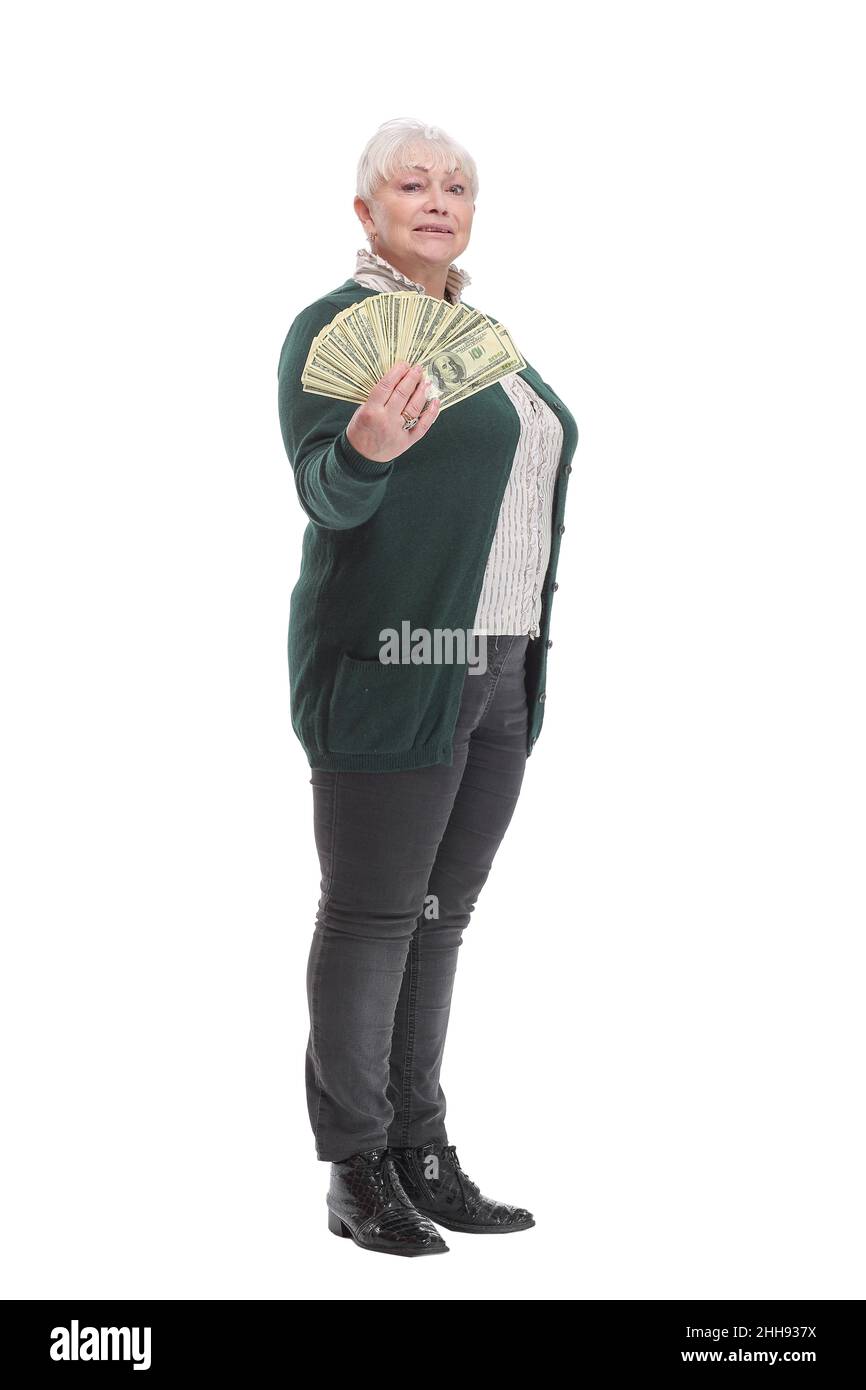 Signora matura gioiosa che tiene un paio di pile di soldi e guardando la macchina fotografica Foto Stock