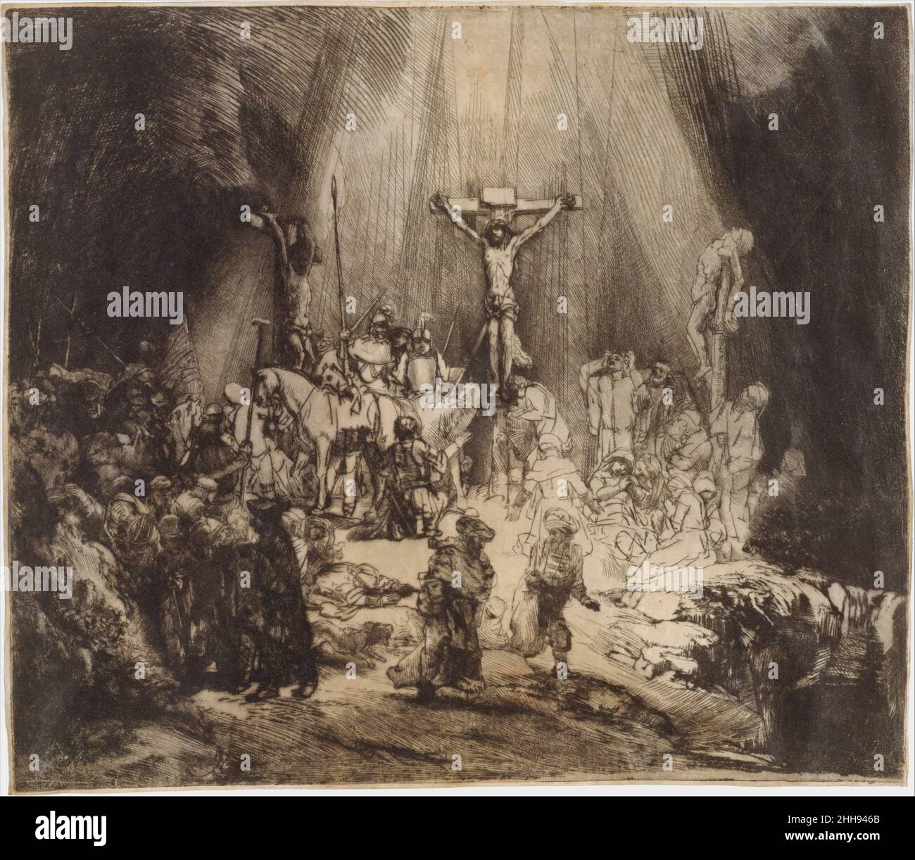 Cristo Crocifisso tra i due ladri: Le tre croci 1653 Rembrandt (Rembrandt van Rijn) Olandese le tre croci, una delle opere più belle di Rembrandt in qualsiasi mezzo, rappresenta il culmine della sua virtuosita' di printmaker. Si attingeva completamente sul copperplate a secco che gli consentiva di sfruttare appieno le aree vellutate di sbavatura sollevate dall'utensile a secco mentre tagliava nel rame. Quando Rembrandt creò questa impressione, lasciò deliberatamente inchiostro sulla lastra di stampa; vela leggermente le figure che si erigono ai piedi della croce a destra; uno strato più spesso copre quasi completamente Foto Stock