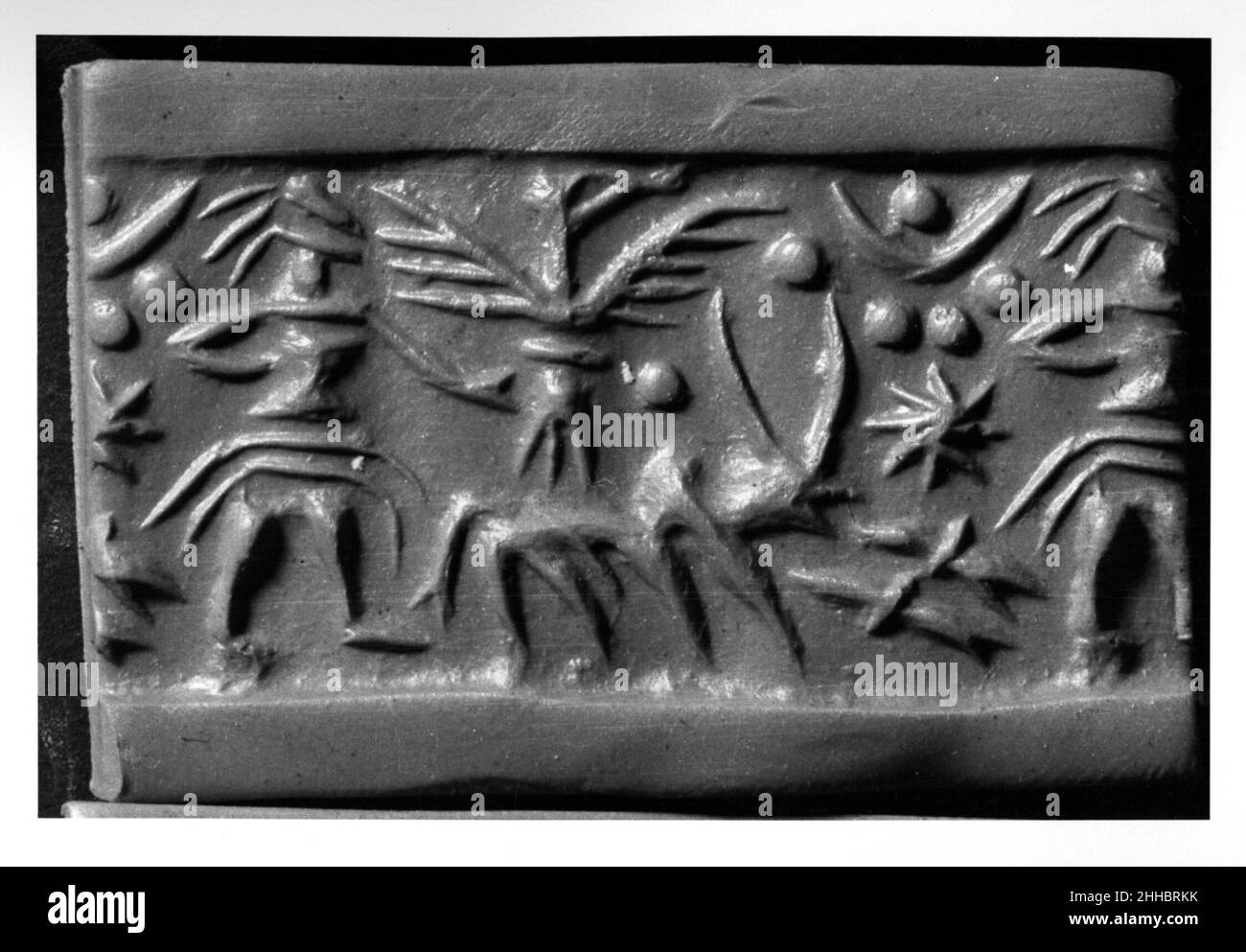 Guarnizione cilindro ca. 15th–13th secolo a.C. Cipriota. Guarnizione del cilindro 321423 Foto Stock