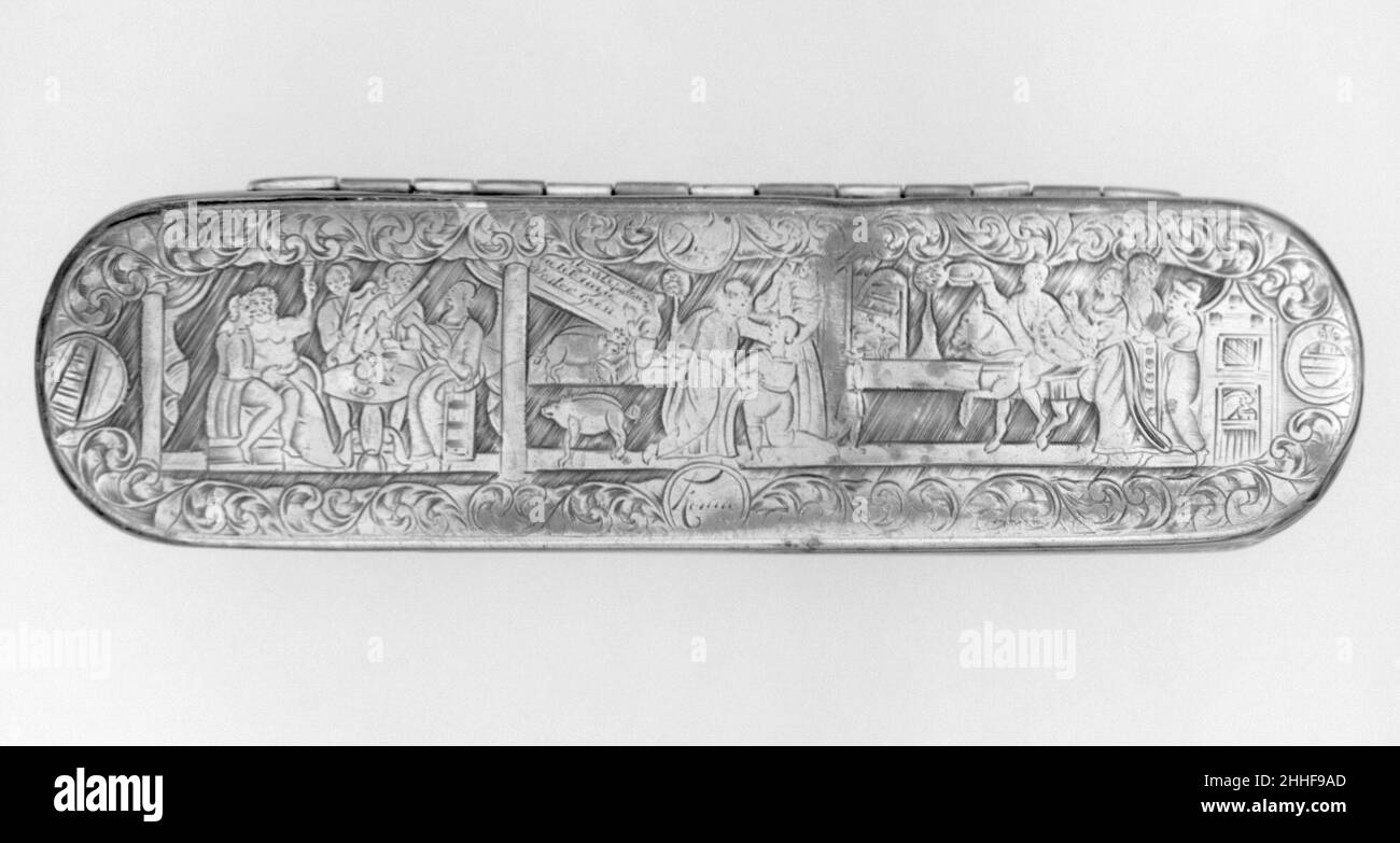 Scatola di tabacco 18th secolo olandese scatola oblunga con estremità arrotondate. Sul coperchio sono raffigurati alcuni episodi della parabola del ricco e del povero Lazzaro, le scene divise da colonne classiche. A destra il malato Lazzaro può essere visto seduto in strada mentre i cani leccano le sue piaghe. Al centro il ricco è a casa, seduto dietro un tavolo da banchetto. A sinistra il ricco è visto ardente nell'inferno e Lazzaro è venuto al trono di Dio in cielo. L'intera rappresentazione è incorniciata da rotoli di foglie che contengono la prima parte di un rebus. Il rebus può essere interpretato come: IVA [barile] Foto Stock