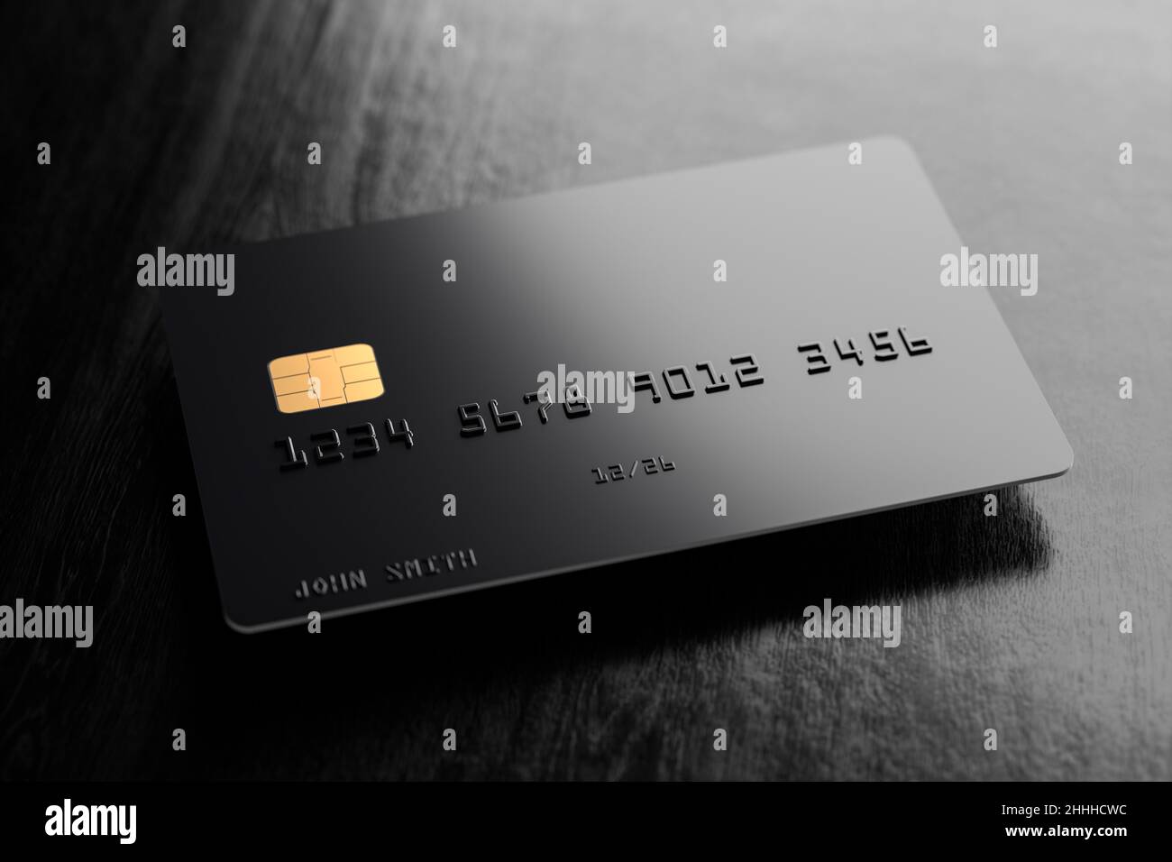 Una carta di credito nera vuota che si sovrappone ad una superficie di  legno nero con ombra Foto stock - Alamy