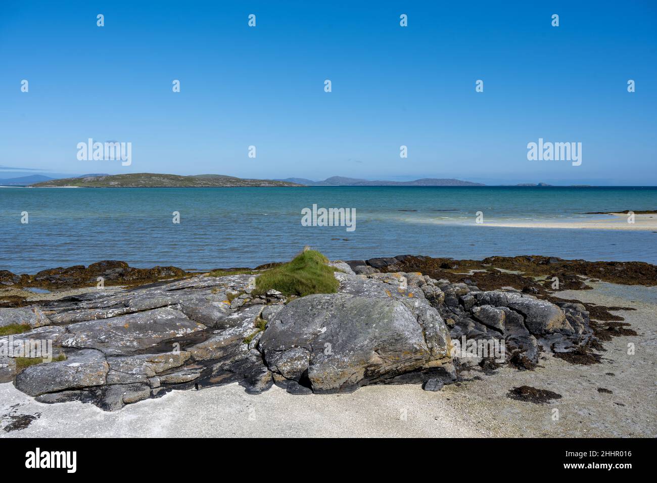 Traigh Mhor (in inglese 'Big Beach') con la piccola isola marea disabitata di Orosay sullo sfondo, Sound of barra, Eoligarry Foto Stock