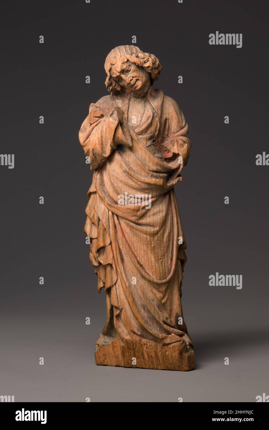 San Giovanni Evangelista, probabilmente di un Gruppo Crocifissione ca. 1420 Tedesco. San Giovanni Evangelista, probabilmente di un Gruppo Crocifissione. Tedesco. CA. 1420. Limewood. Fabbricato nella Renania Settentrionale, in Germania. Legno-di-scultura-miniatura Foto Stock