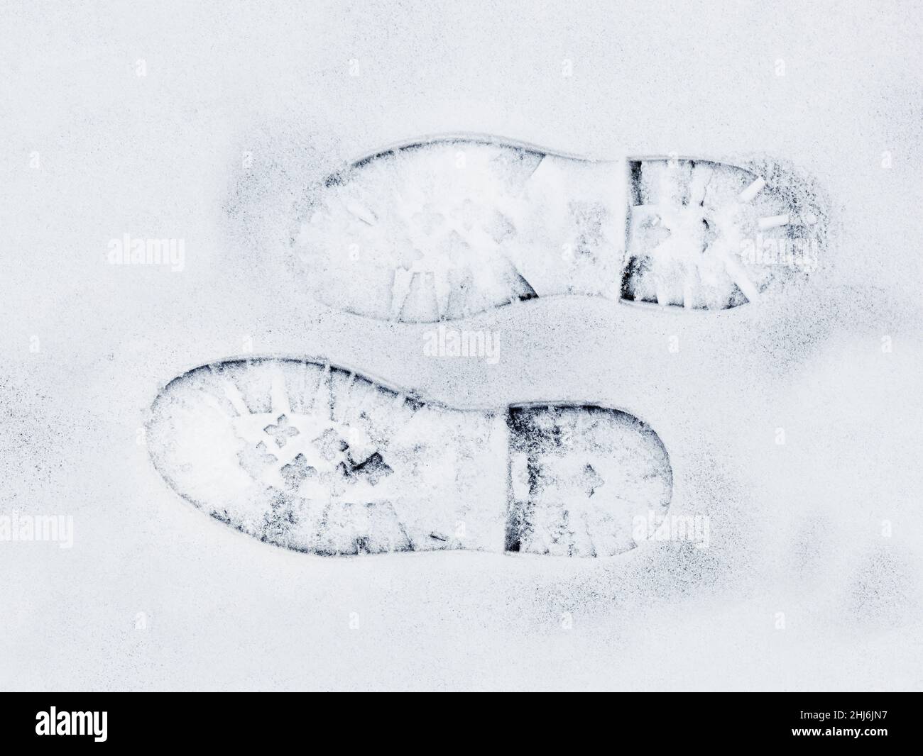 Piedi di stampe in neve fresca Foto Stock