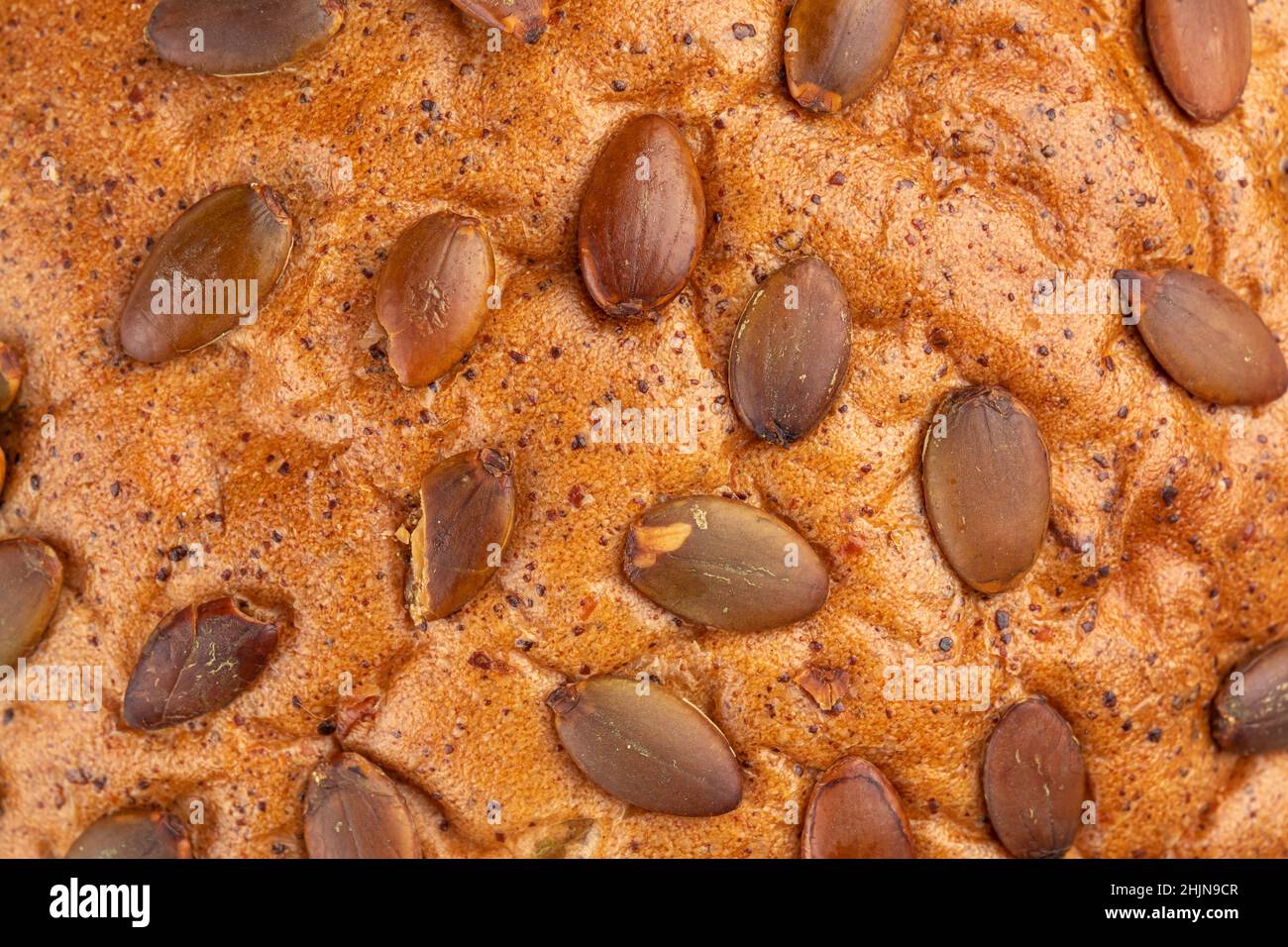 Primo piano su semi di zucca consistenza del pane Foto Stock