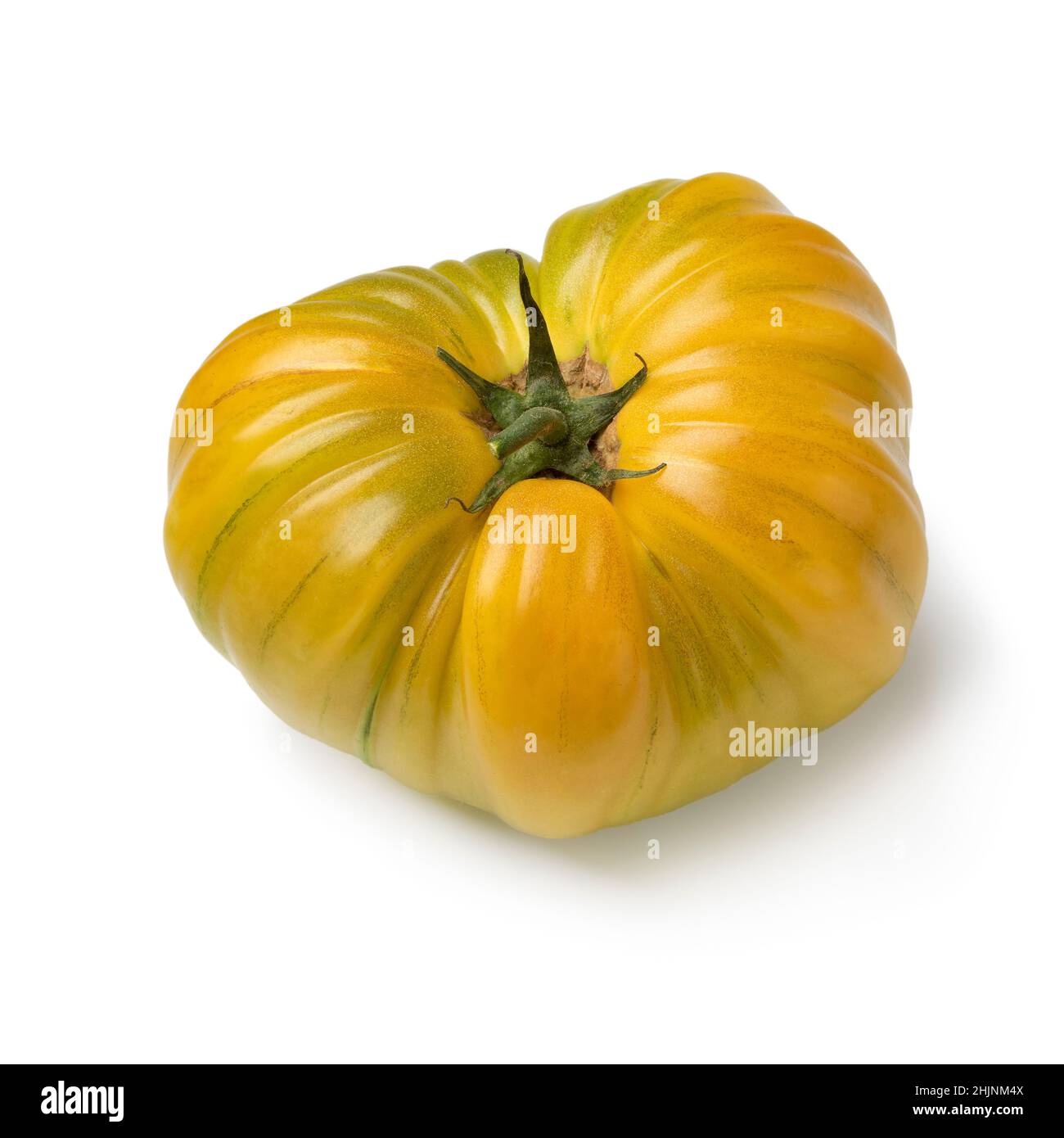 Singolo pomodoro giallo coeur de boeuf isolato su sfondo bianco Foto Stock