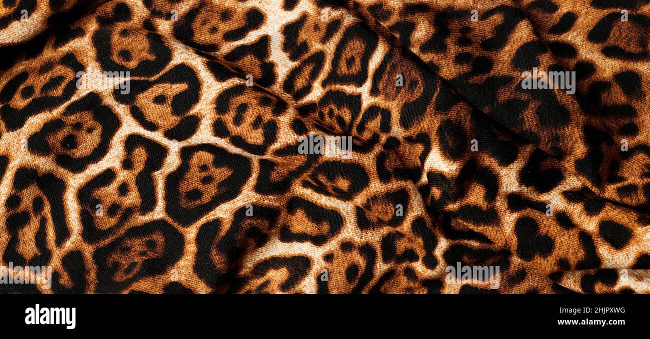 un tessuto di stampa panther drappeggiato da utilizzare come sfondo Foto Stock