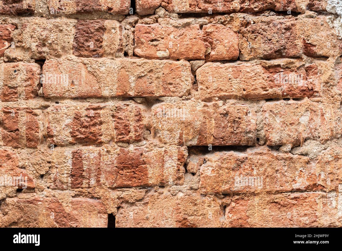 Muro di pietra in mattoni di pietra di vecchio edificio Foto Stock