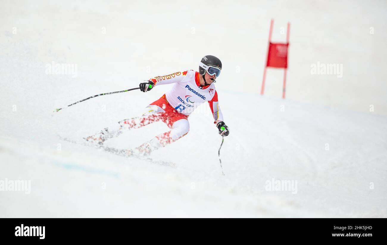 Mac MARCOUX del Canada segue le grida della sua guida nella Slalom gigante dello Sci Alpino Mens durante i Giochi Paralimpici invernali del 2014 al Rosa Khuti Foto Stock