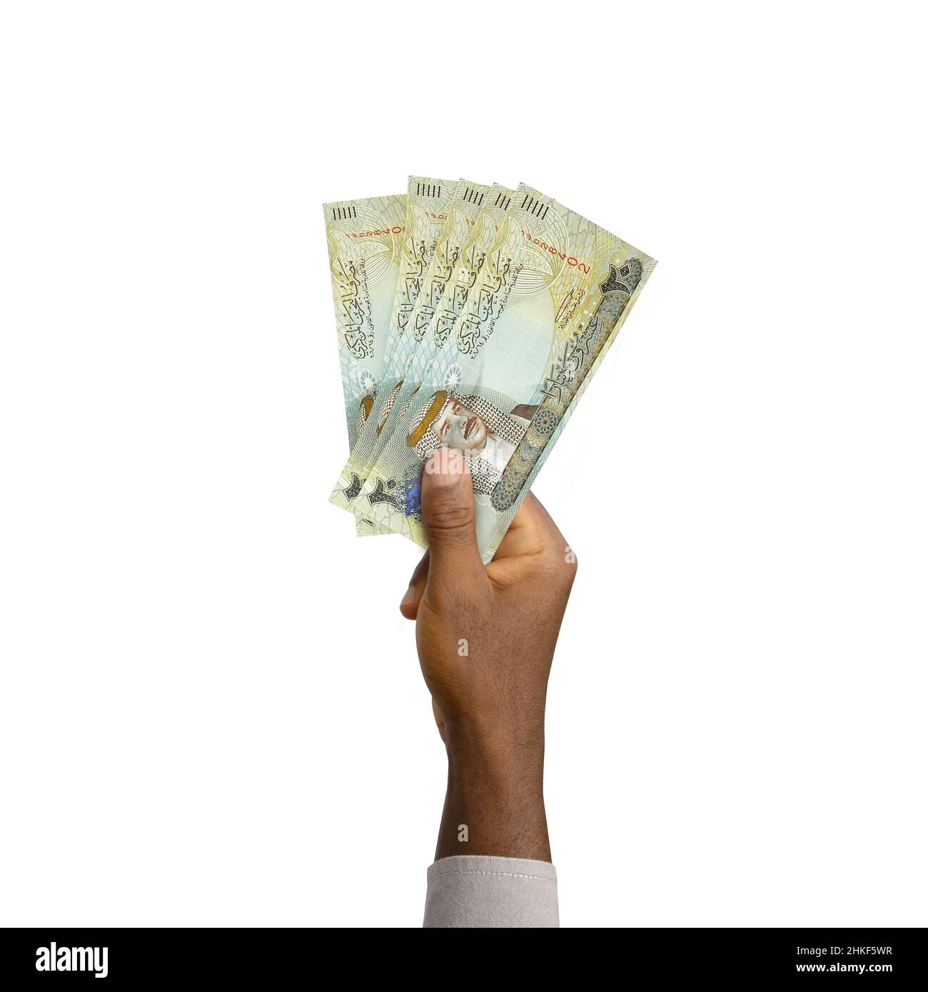 Mano nera che tiene 3D reso 20 Bahrain Dinar note isolate su sfondo bianco Foto Stock
