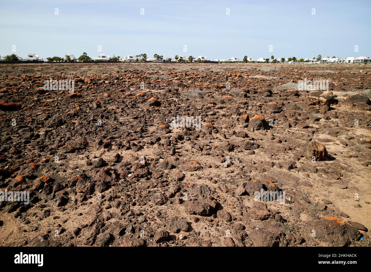 Pietra vulcanica campi di pietra costruire terreno di sviluppo a playa blanca Lanzarote Isole Canarie Spagna Foto Stock