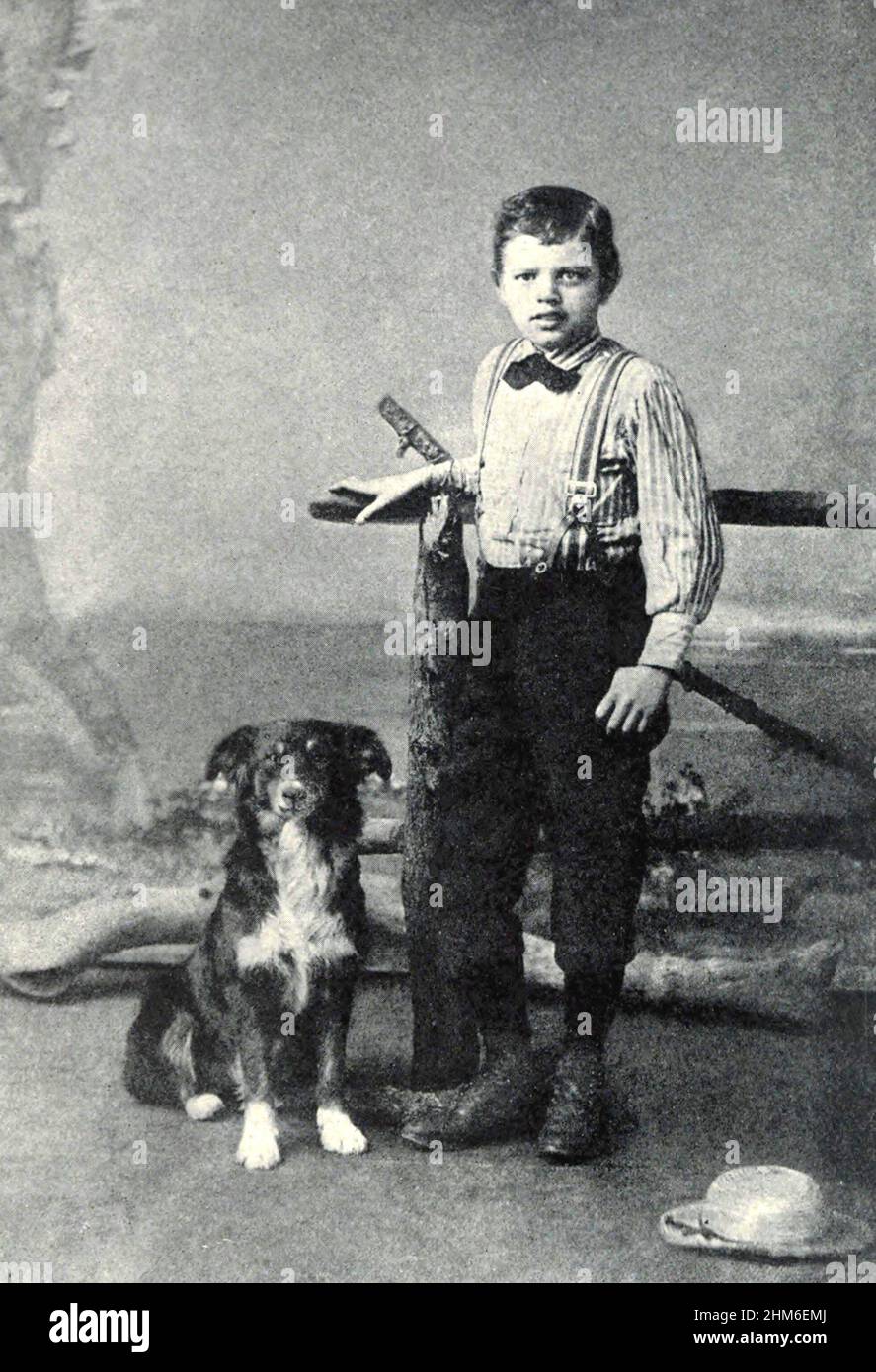 Lo scrittore americano Jack London (vero nome John Griffith Chaney), autore di Call of the Wild e White Fang. Foto del 1885 quando l'autore era 9, visto con il suo cane Rollo. Foto Stock
