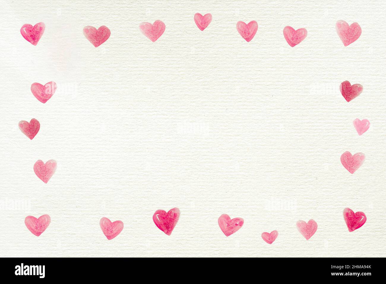Sfondo d'amore con una cornice fatta da molti cuori dipinta su una carta  bianca riciclata per San Valentino o altre celebrazioni, lettera, spazio  copia Foto stock - Alamy
