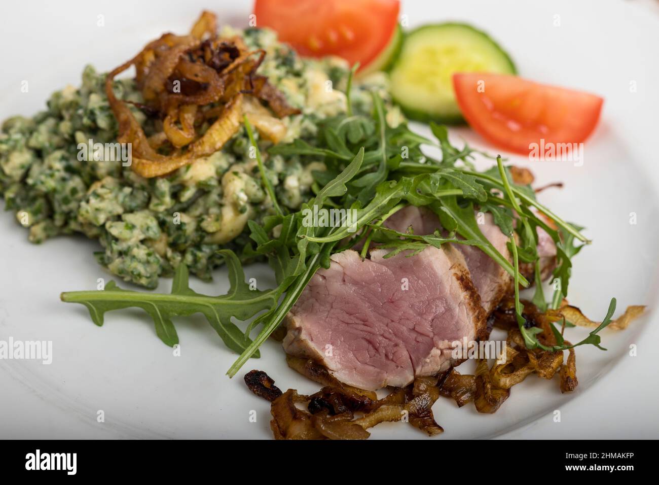 fettine di filetto di maiale con spaetzle Foto Stock