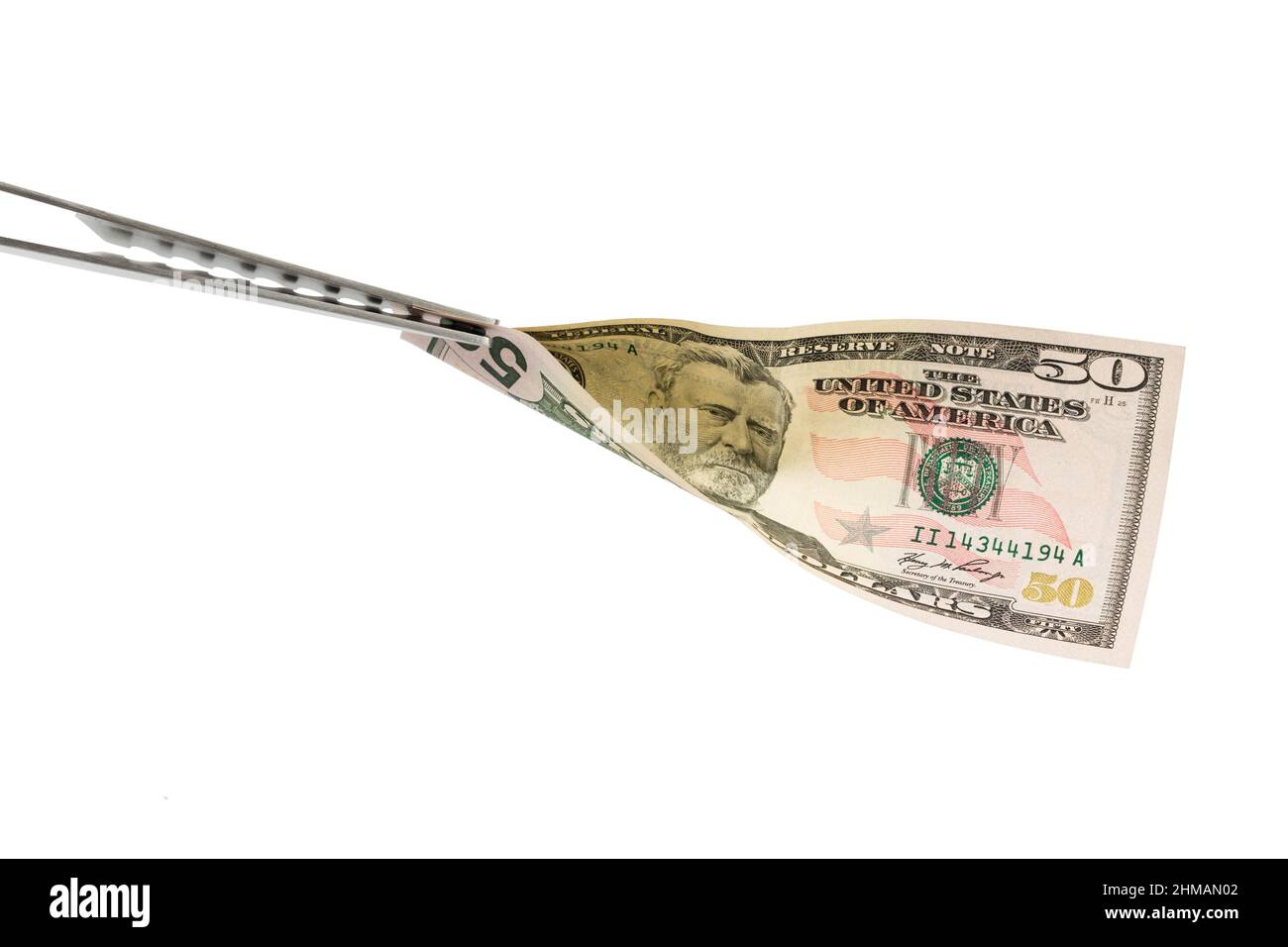 Un'attrezzatura per barbecue come simbolo di corruzione. Isolato su sfondo bianco. Primo piano. Foto Stock