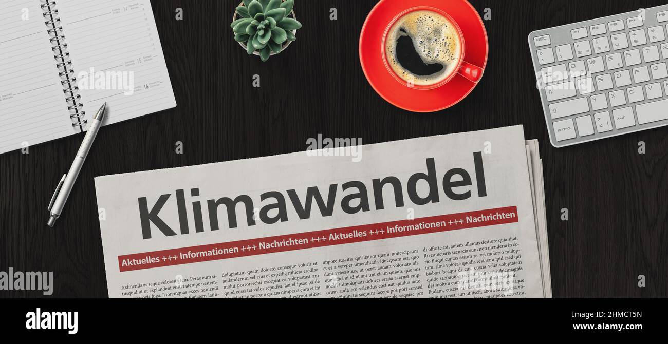 Quotidiano su una scrivania - cambiamenti climatici in tedesco - Klimawandel Foto Stock