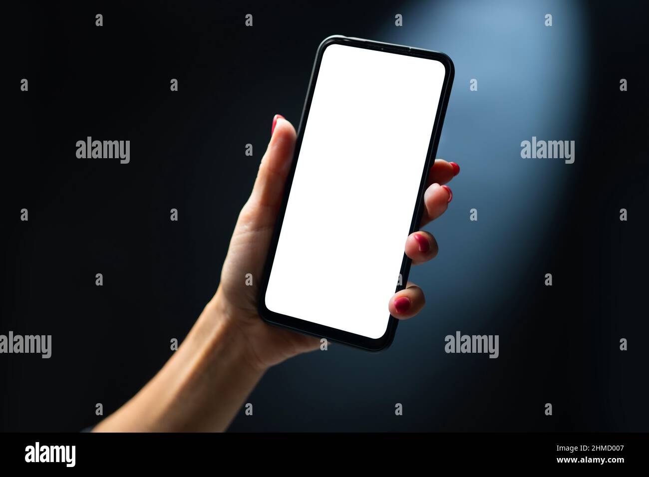 Mano azienda smartphone Foto Stock