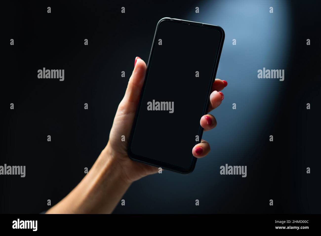 Mano azienda smartphone Foto Stock