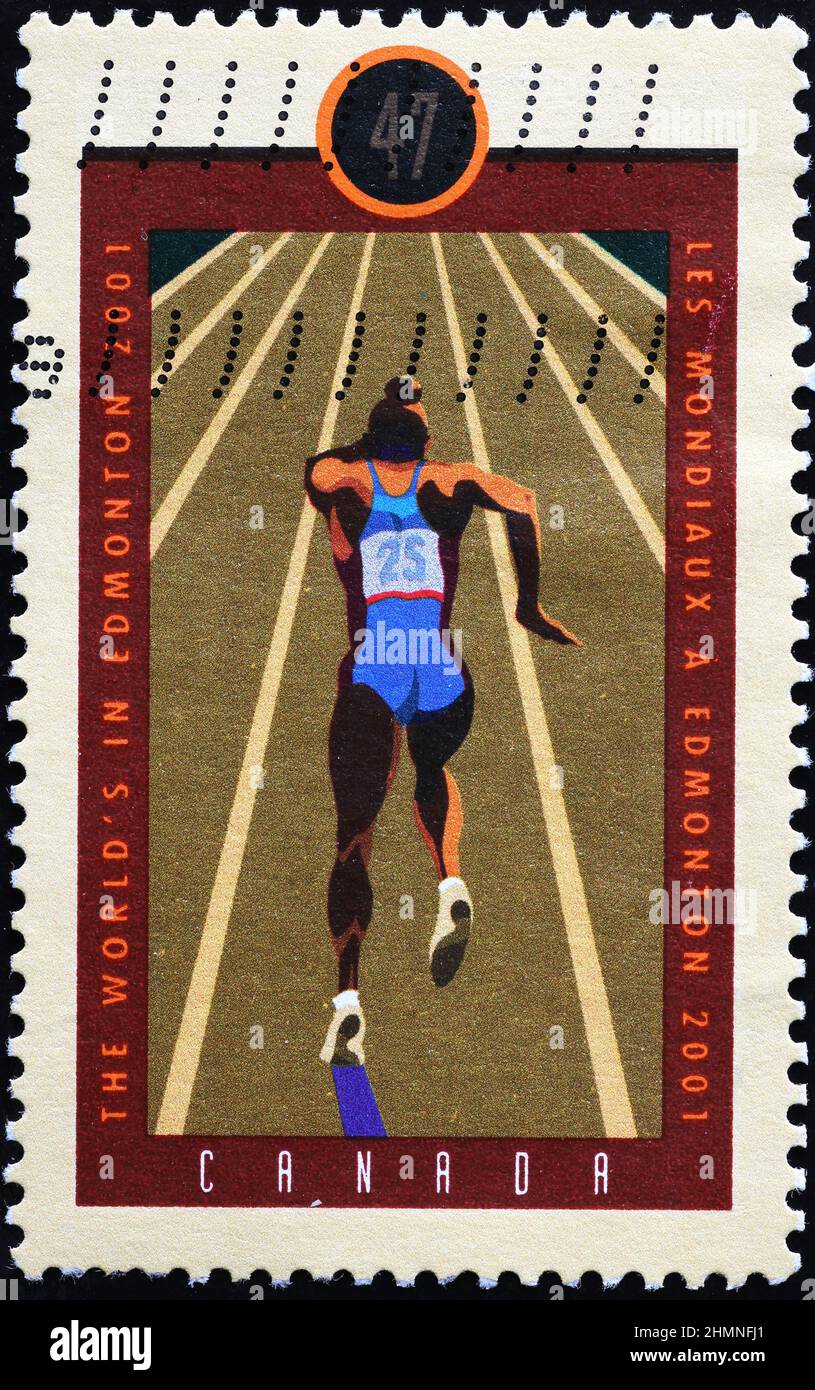 Sprinter in esecuzione su francobollo canadese Foto Stock