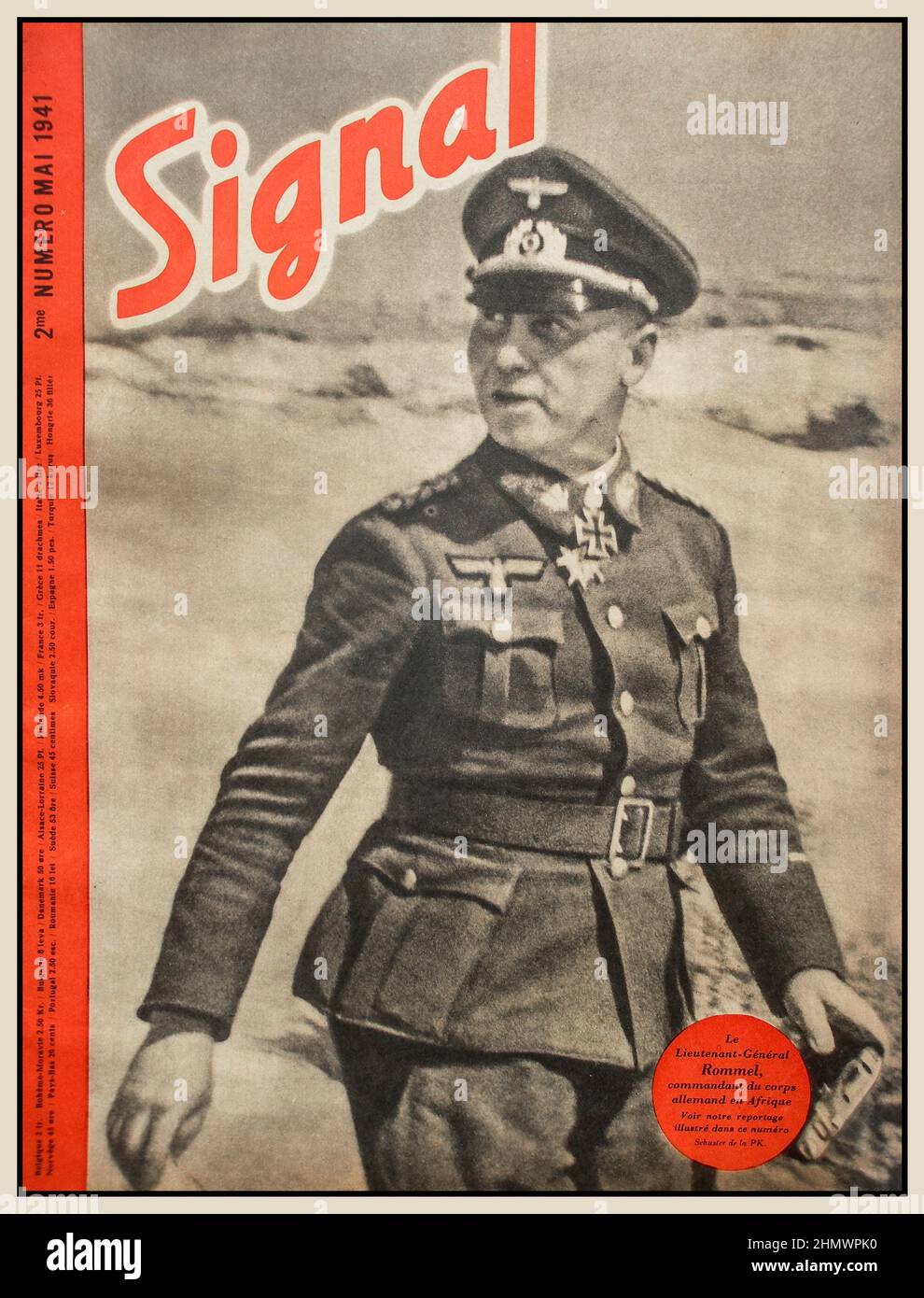 SIGNAL WW2 1941 la rivista militare nazista Propaganda 'SIGNAL' con il Field Marshall Erwin Rommel sulla copertina. Un eroe della Germania nazista, il cui soprannome era 'Desert Fox' a causa delle sue strategie di battaglia carri armati di successo nel deserto occidentale africano. Signal fu una rivista pubblicata dal Wehrmacht della Germania nazista dal 1940 al 1945. Lingua: 26 lingue europee cessate la pubblicazione: Aprile 1945 Editore: Deutscher Verlag per conto delle truppe Wehrmacht Propaganda Foto Stock