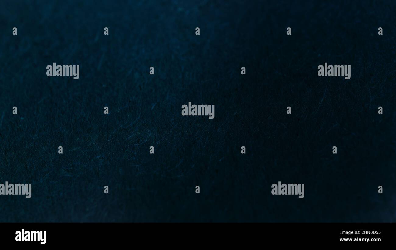 Sfondo monocromatico astratto scuro con effetto testurizzato. Foto Stock