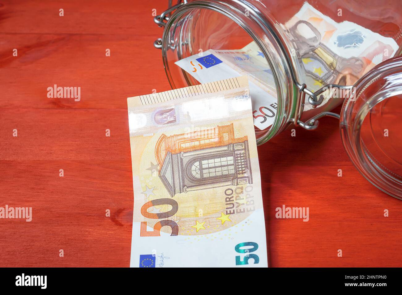 Moneybox, banconota euro in vetro Foto Stock