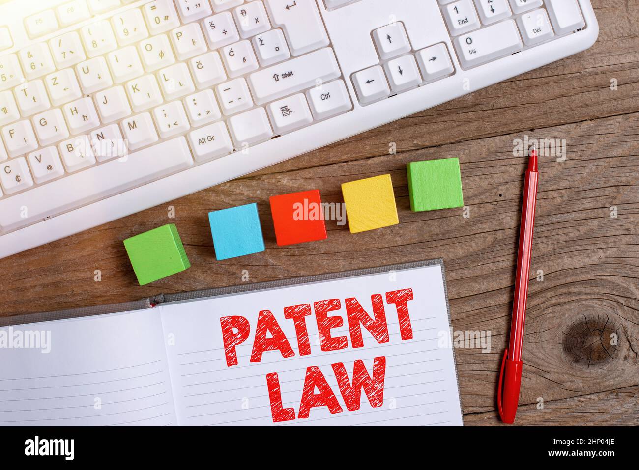 Scrittura di testo visualizzazione Legge sui brevetti, Word per le trattative con un inventore s è diritto esclusivo di utilizzare la propria invenzione Stack di Sample Cube caselle rettangolari o Foto Stock