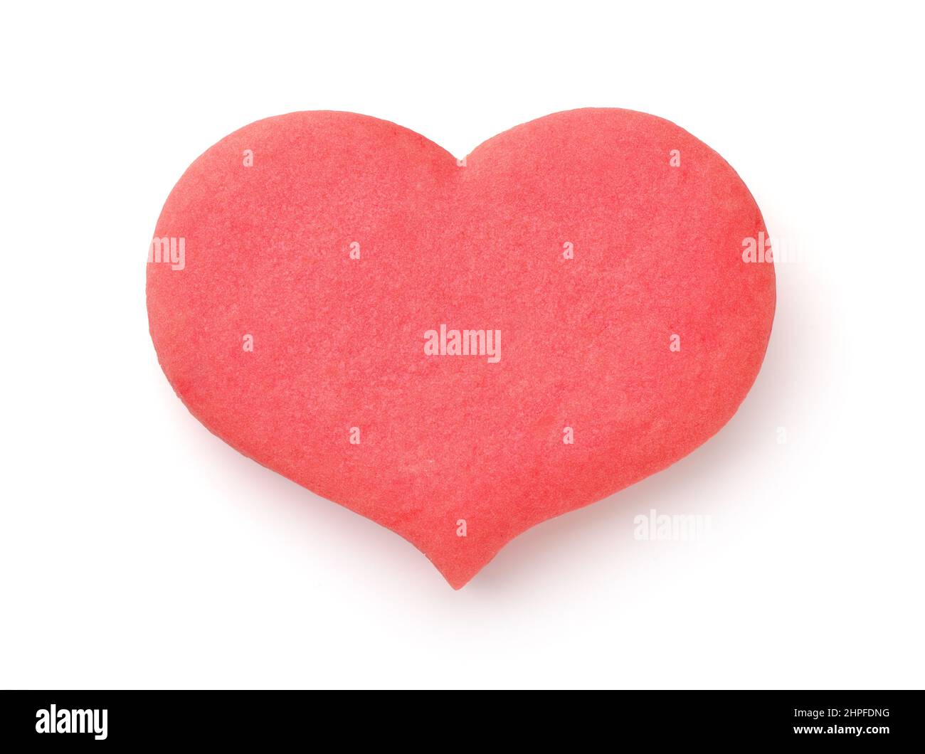 Vista dall'alto del biscotto rosa a forma di cuore isolato su bianco Foto Stock