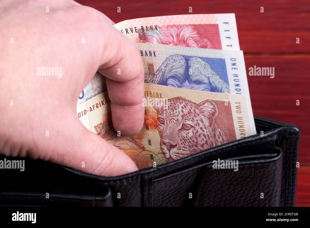 Vecchio denaro sudafricano - Rand nel portafoglio nero Foto Stock