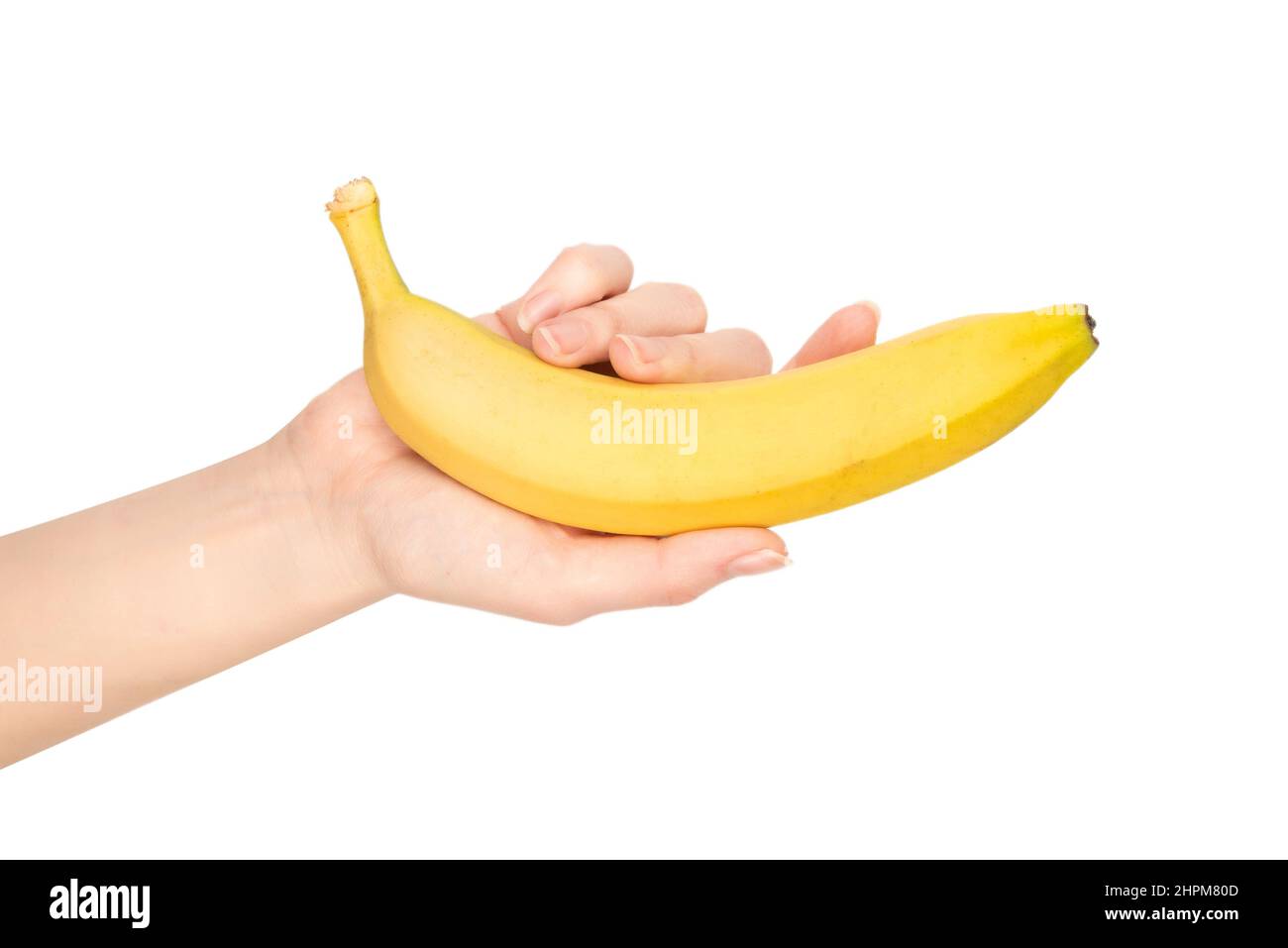 Un mazzo di banane in mano donna isolato su sfondo bianco. Foto Stock