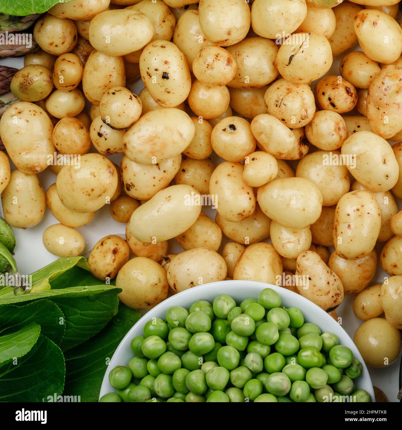 Piselli e patate Foto Stock