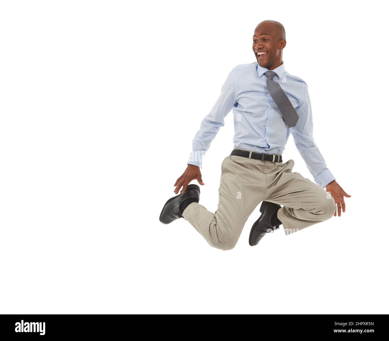 HES in cima al mondo. Un uomo d’affari afro-americano che salta nell’aria. Foto Stock