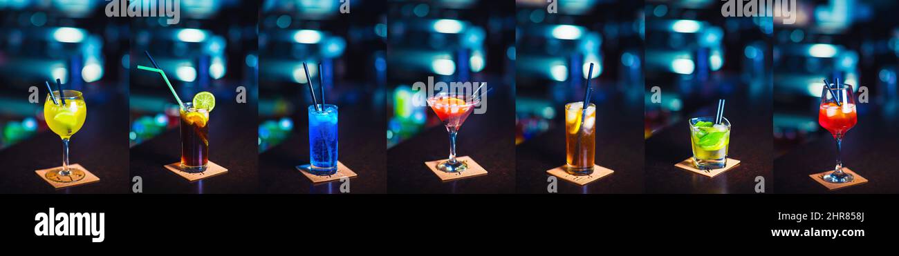 Collezione di cocktail colorati sul banco del bar Foto Stock