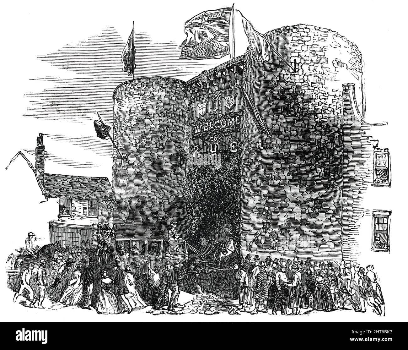 Processione alla porta Vecchia, Rye, 1850. Visita di Stato di Thomas Farncomb, sindaco di Londra, nella città di Rye in Sussex. "La giornata sarà memorabile negli annali del quartiere, segnata non solo dalla visita di Stato del Signore Sindaco, ma dall'apertura della linea ferroviaria da Ashford a Rye, Che fu, per questa occasione speciale, messo a disposizione del Signore Sindaco e dei suoi amici... all'arrivo in città la processione passò Landgate [un residuo delle mura della città vecchia], che era magnificamente decorata con fiori e sempreverdi...su questo antico edificio era il motto, "Welc Foto Stock