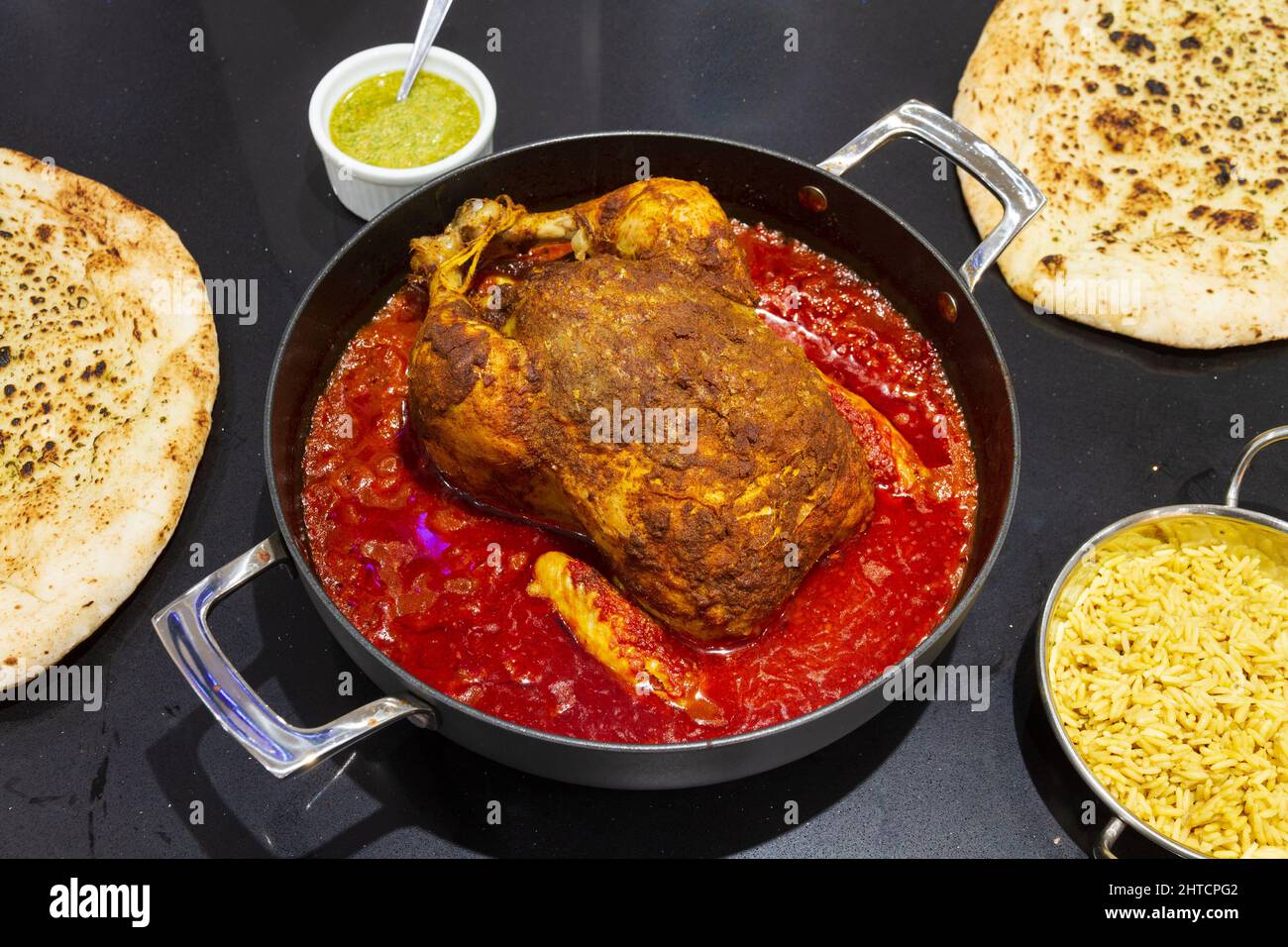 un piatto di pollo arrosto speziato Foto Stock