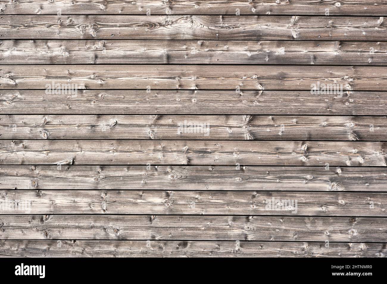 Sfondo da un muro fatto di tavole orizzontali di legno Foto Stock