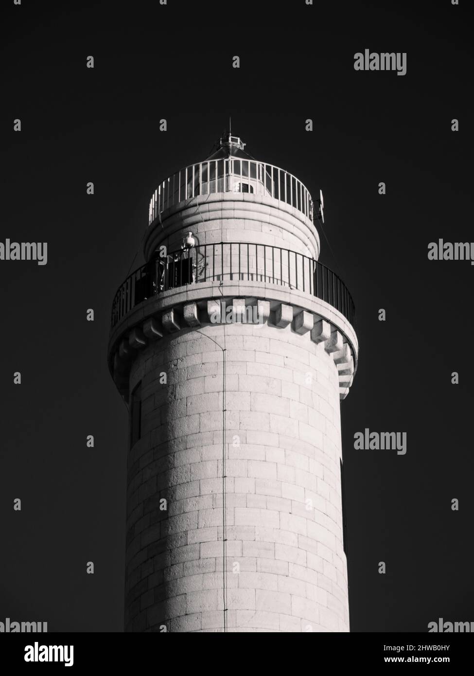 Faro di Murano Faro dell'Isola di Murano nella Laguna di Venezia, Italia in pietra bianca con doppio balcone e Lanterna Foto Stock