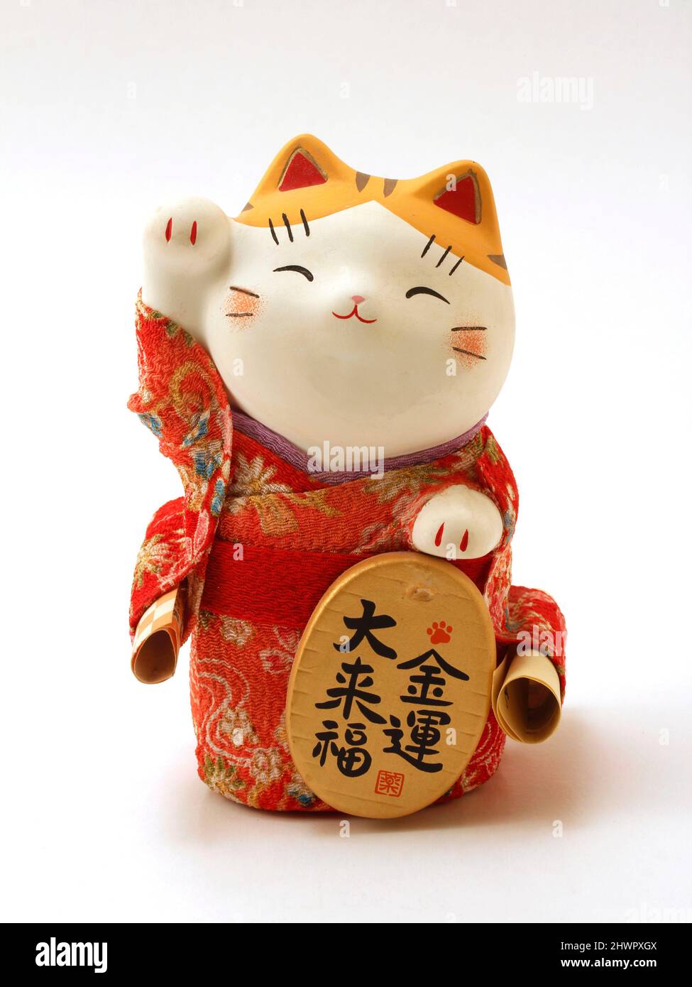 Maneki neko. Tipico gatto giapponese di fortuna. Foto Stock