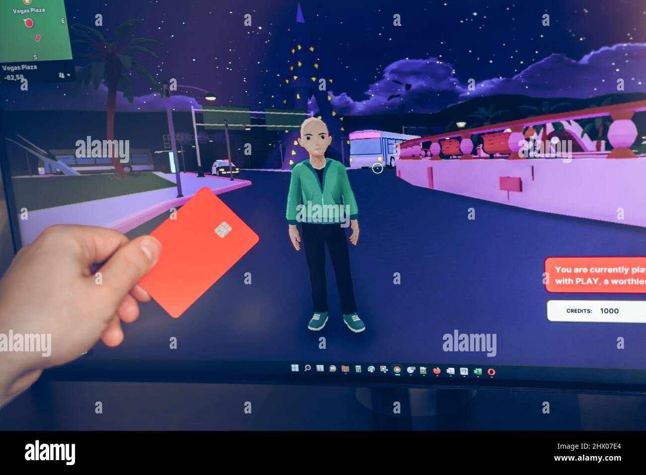 Russia Mosca 19.01.2022 Logo di metaverse. Investire nell'universo digitale, nel settore immobiliare. Acquistare terreno nel mondo virtuale. Blockchain nft Cryptocurrency.Man w Foto Stock