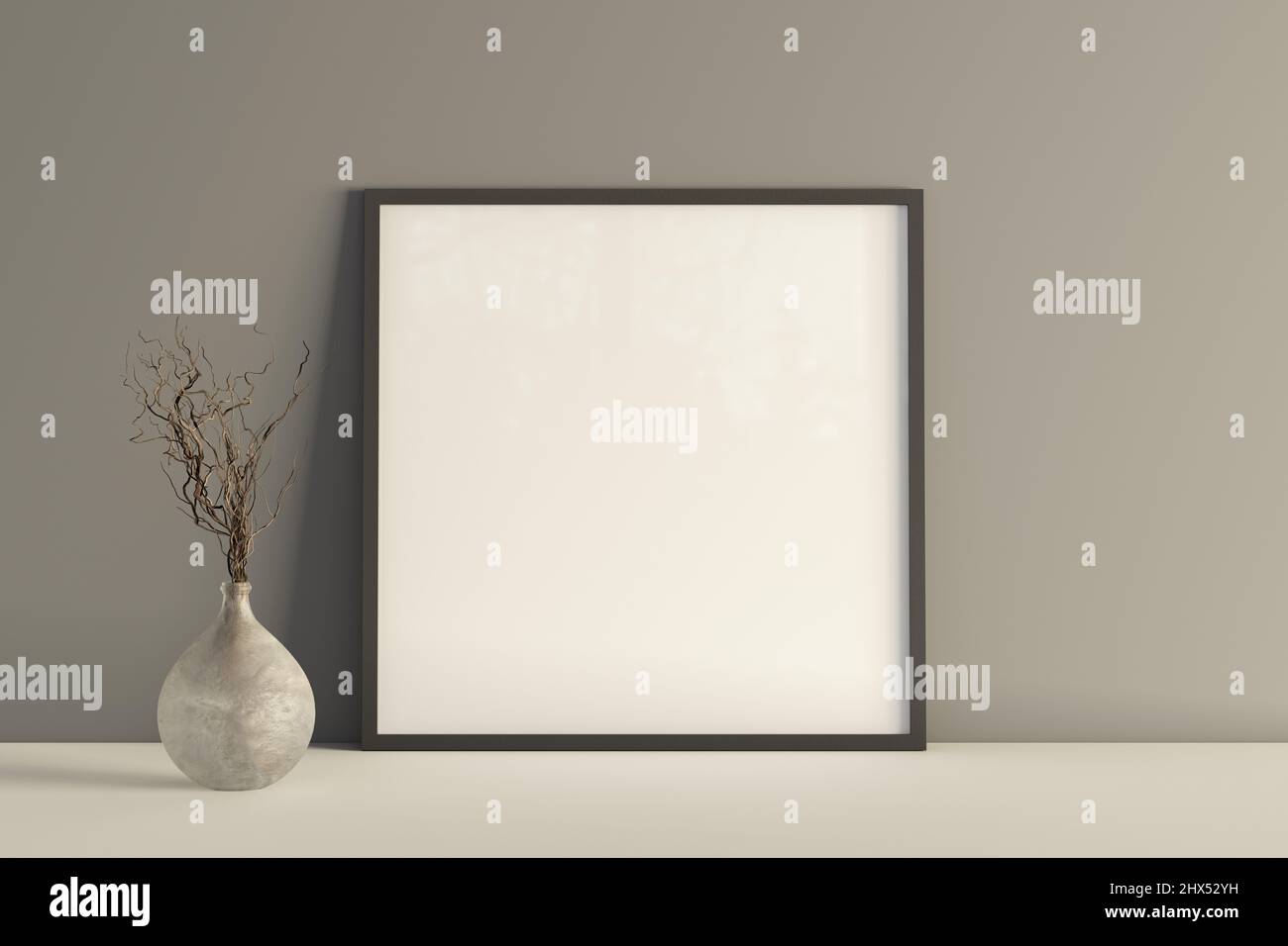 Poster con cornice quadrata sul tavolo bianco con parete grigia sullo sfondo Foto Stock