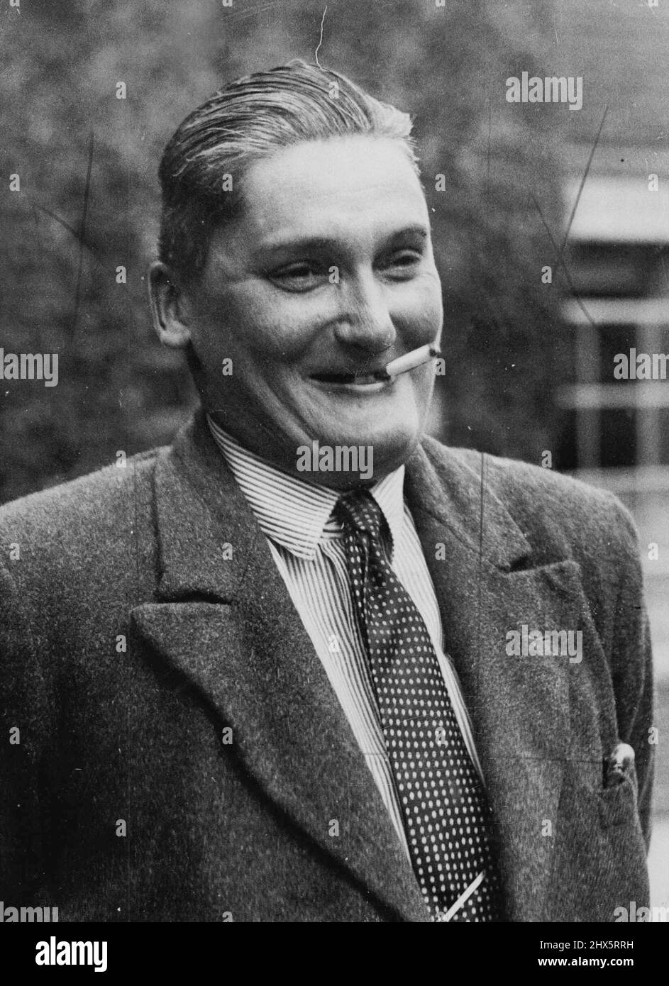 Accusato come 'John Hill' presso un tribunale di Londra con rubare una borsa, questa persona, rivestito di flanella sportiva, ammesso di essere una donna. Il suo vero nome è Lilian Irma Valerie Arkell Smith. Gennaio 1, 1934. Foto Stock