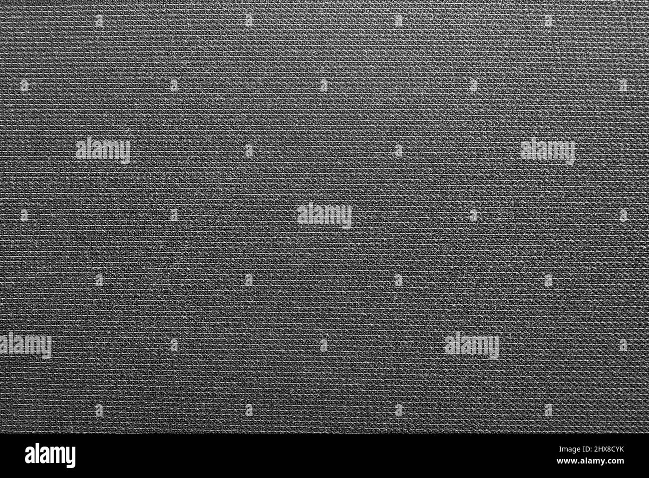 Il tessuto è grigio denso con linee geometriche e cuciture diritte. Materiale di colore scuro per tappezzeria di mobili, sartoria Foto Stock