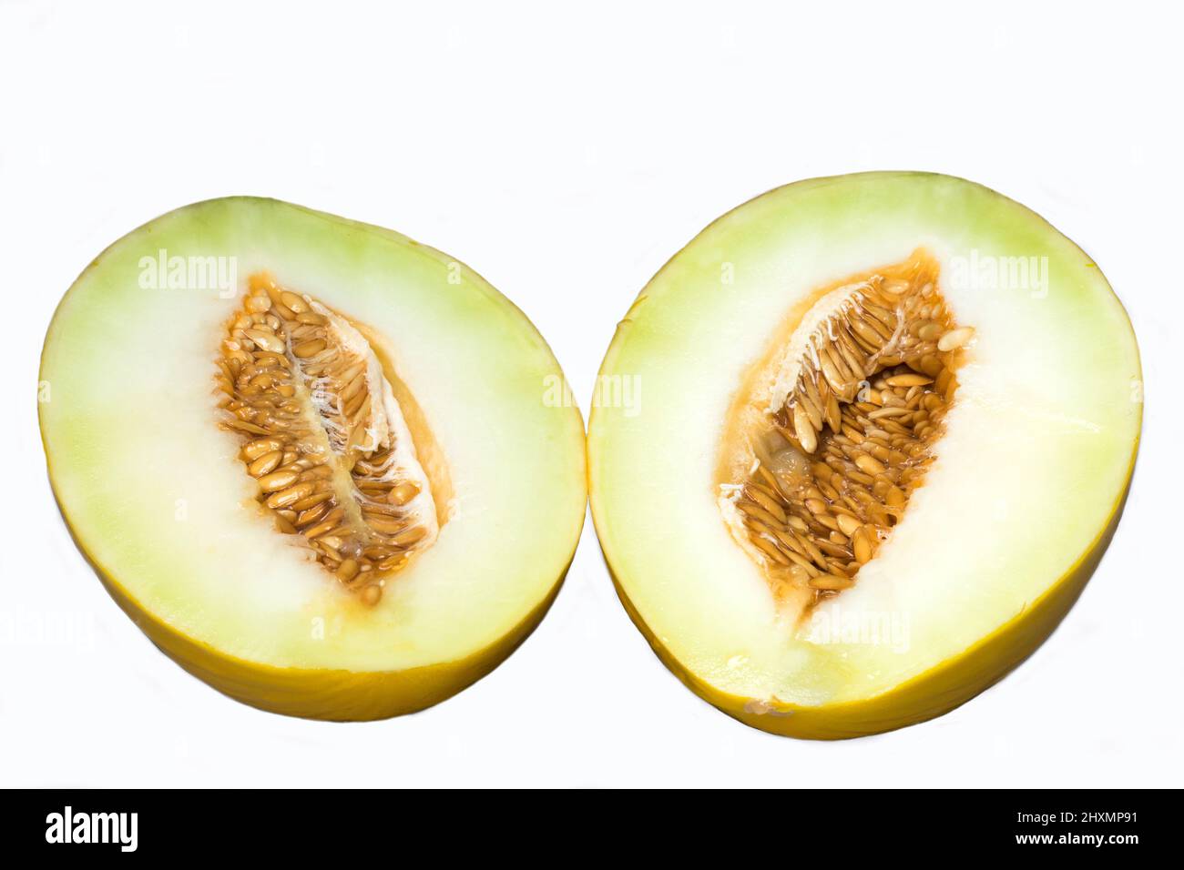 Metà Honeydew Melon visualizzati semi Foto Stock
