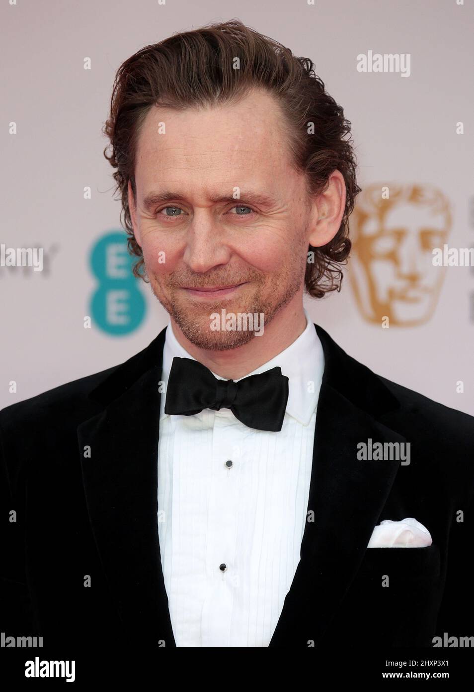 13 marzo 2022 - Londra, Inghilterra, Regno Unito - Tom Hiddleston partecipa al BAFTA Film Awards 2022, Royal Albert Hall Foto Stock