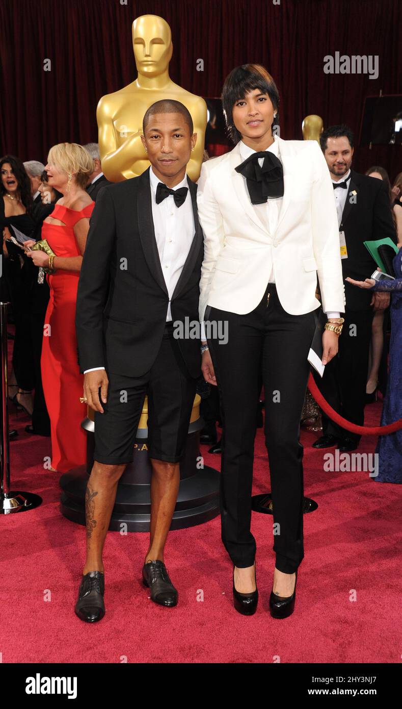 Pharrell Williams e Helen Lasichanh arrivano all'86esimo Academy Awards tenutosi al Dolby Theatre di Hollywood, Los Angeles, California, USA, 2 marzo 2014. Foto Stock